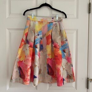 H&M multi-colored, box pleat midi skirt with exposed zipper. Size 6.